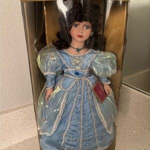 Elegant Blue Doll with Curly Hair